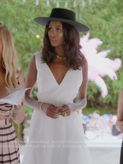 Kiki’s white textured v-neck dress on The Real Housewives of Miami