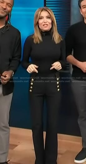 Kit’s black pants with gold buttons on Access Hollywood