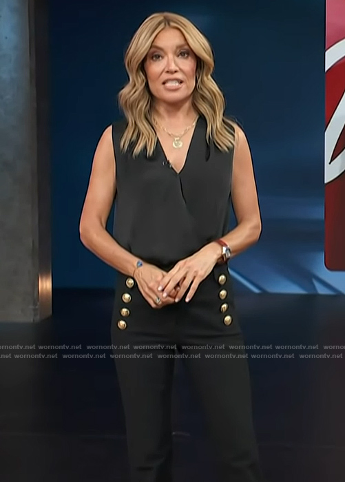 Kit’s black pants with gold buttons on Access Hollywood