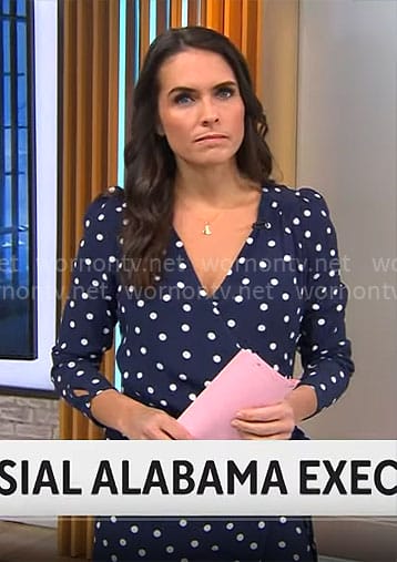 Lilia Luciano’s navy polka dot wrap dress on CBS Mornings