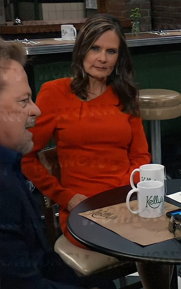 Lucy’s red long sleeved dress with asymmetric neckline on General Hospital