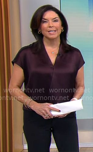 Meg Oliver’s dark purple satin top on CBS Mornings
