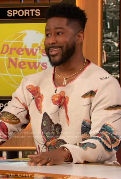 Nate Burleson’s white butterfly print sweater on The Drew Barrymore Show