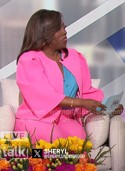 Sheryl’s bright pink jacket and pants on The Talk