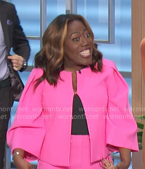 Sheryl’s bright pink jacket and pants on The Talk