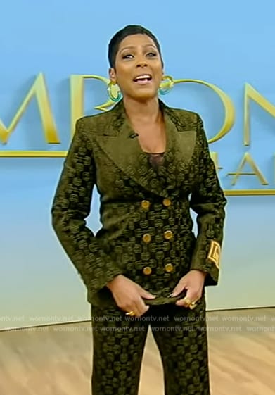 Tamron’s green velvet horsebit suit on Tamron Hall Show