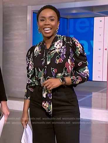 Zinhle’s black floral print tie neck blouse on NBC News Daily