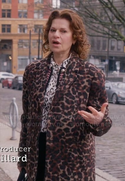 Belinda’s white leopard blouse and leopard print coat on So Help Me Todd
