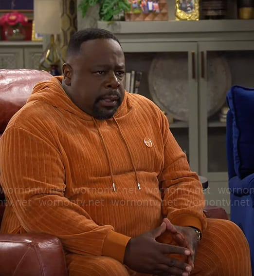 Calvin’s orange chenille hoodie and pants set on The Neighborhood
