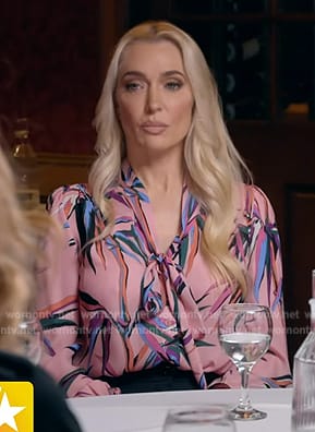 Erika Jayne’s pink floral print tie neck blouse on Access Hollywood