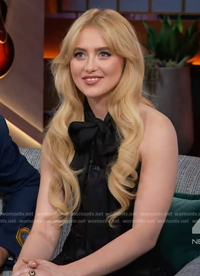 Kathryn Newton’s black floral print tie neck dress on The Kelly Clarkson Show