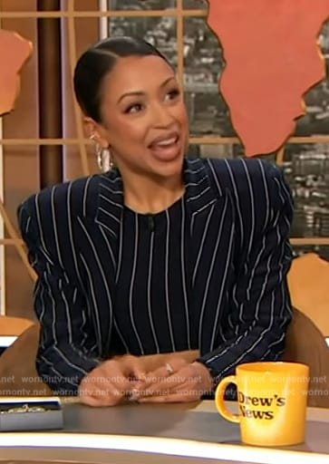 Liza Koshy’s navy pinstripe top and coat on The Drew Barrymore Show