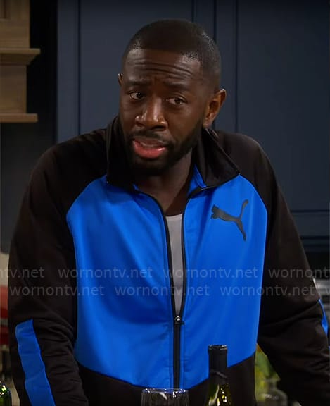 Malcolm’s blue and black jacket on The Neighborhood