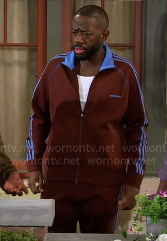 Malcolm’s burgundy jacket with blue stripes on The Neighborhood