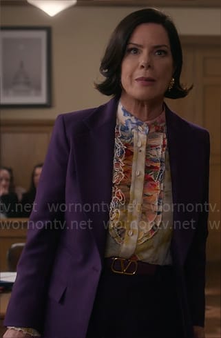 Margaret’s purple suit, floral ruffled blouse and yellow crystal earrings on So Help Me Todd