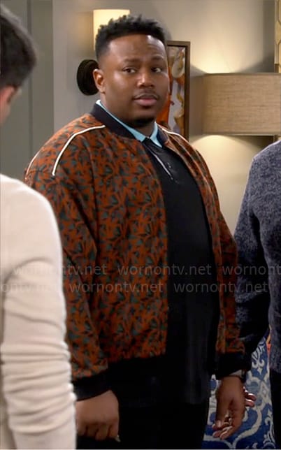 Marty’s orange printed bomber jacket on The Neighborhood