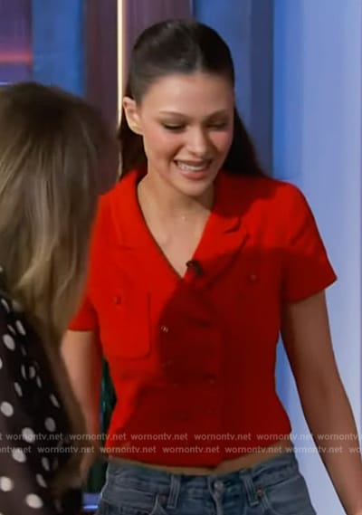 Nicola Peltz’s red cropped cardigan on The Kelly Clarkson Show