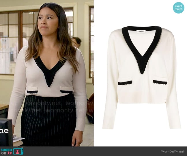 Sandro V-neck wool-blend jumper worn by Nell Serrano (Gina Rodriguez) on Not Dead Yet