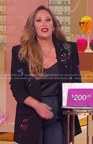 Cheryl Burke’s black embroidered blazer and patch pocket jeans on The Jennifer Hudson Show
