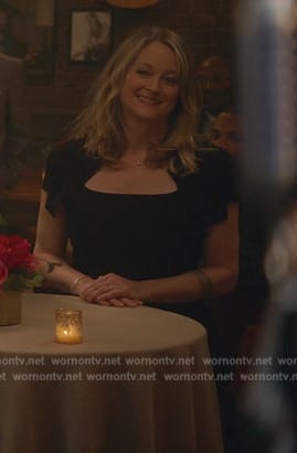 Stef’s black asymmetric neck dress on Good Trouble