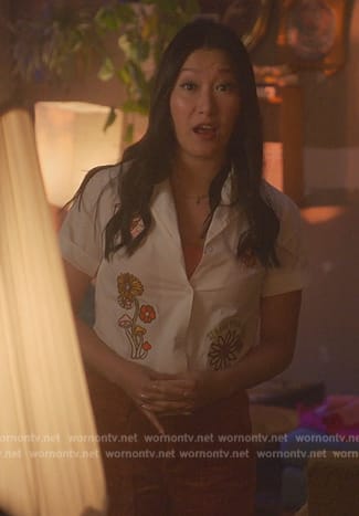 Sumi’s white floral embroidered shirt on Good Trouble