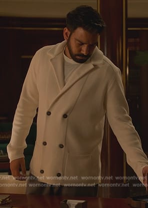 Sunil’s white double breasted cardigan on Death and Other Details
