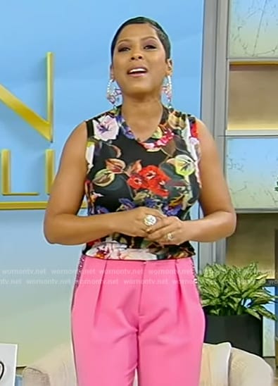 Tamron’s black floral print tank and embellished pink pants on Tamron Hall Show