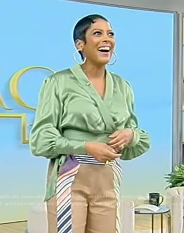 Tamron’s green satin wrap blouse on Tamron Hall Show