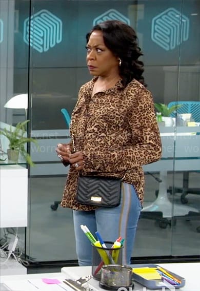 Tina’s leopard print button down top on The Neighborhood