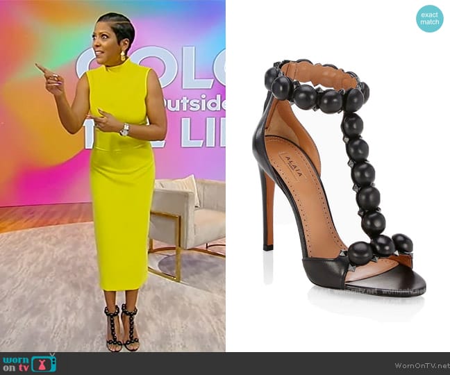 Alaia Bombe T-Strap Leather Black Sandals worn by Tamron Hall on Tamron Hall Show