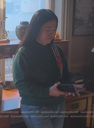Alice’s green A patch sweater on Good Trouble