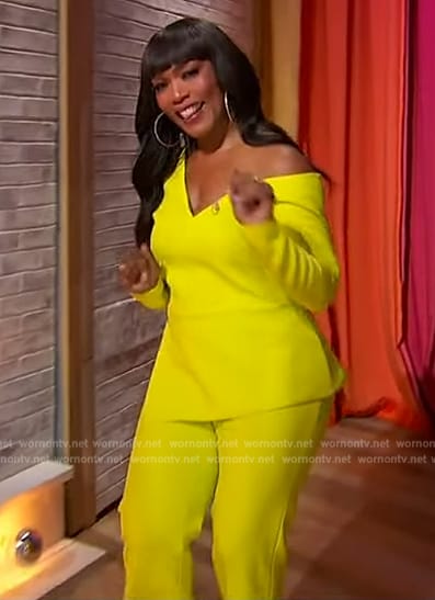 Angela Bassett’s neon asymmetric top and pants on Sherri