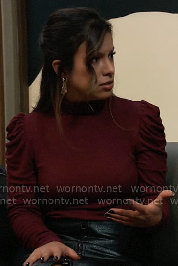Blaze’s burgundy puff sleeve top and leather skirt on General Hospital