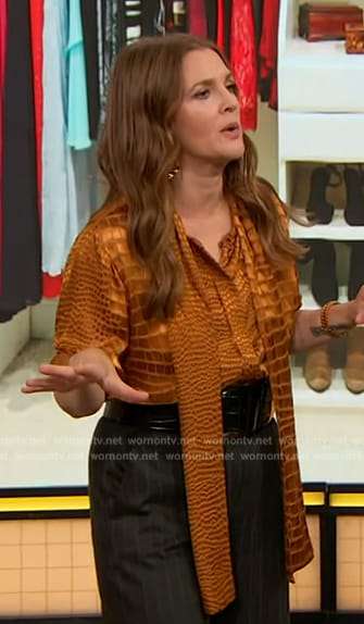 Drew’s orange crock skin satin blouse on The Drew Barrymore Show