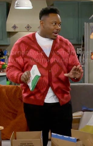 Marty’s red and pink printed cardigan on The Neighborhood