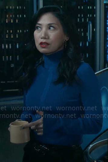 Mel’s blue turtleneck on The Equalizer