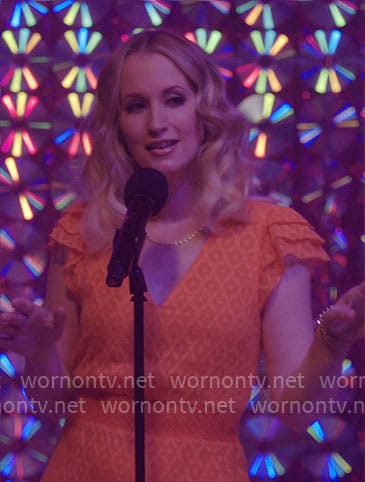 Pixie’s orange v-neck dress on Girls5eva