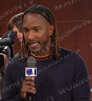 Reporter’s striped neck sweater on Days of our Lives