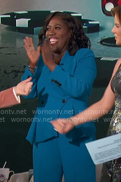 Sheryl’s blue peplum jacket and pants suit on The Talk