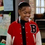 Aaliyah’s red B embroidered varsity jacket on The Upshaws
