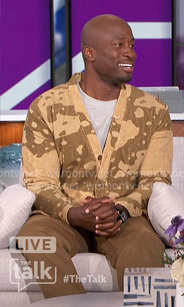 Akbar’s khaki splatter print cardigan on The Talk