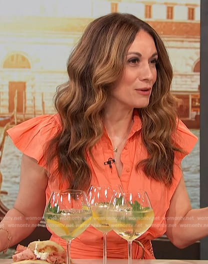 Anna Francese Gass’s orange ruffle belted mini dress on Access Hollywood