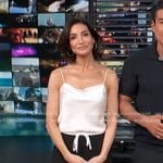 Courtney Lopez’s white cami and black tie waist pants on Access Hollywood