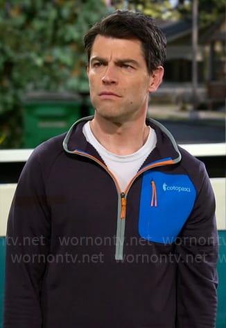 Dave’s half-zip pullover with blue pocket on The Neighborhood