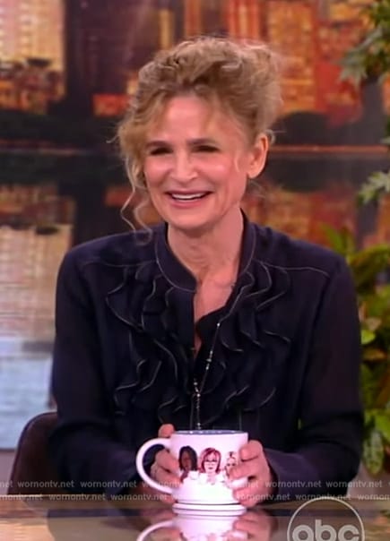 Kyra Sedgwick’s navy ruffle blouse on The View
