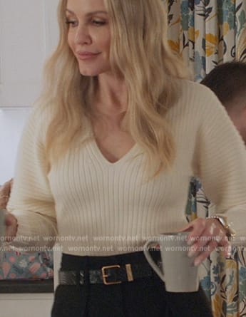 Laura’s white puff sleeve sweater on All American