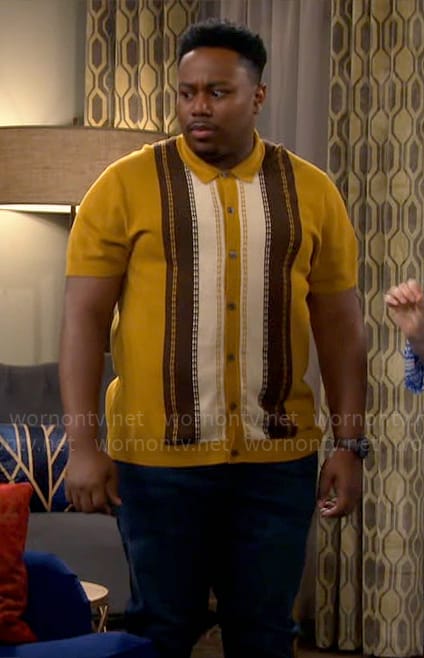 Marty’s yellow vertical striped shirt on The Neighborhood