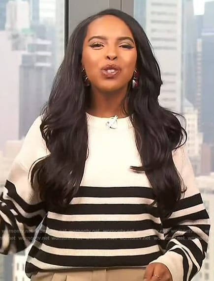 Mona’s white striped sweater on Extra