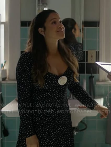 Nell’s black dotted dress with rosette on Not Dead Yet