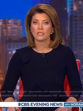 Norah’s navy ruffle trim dress on CBS Evening News